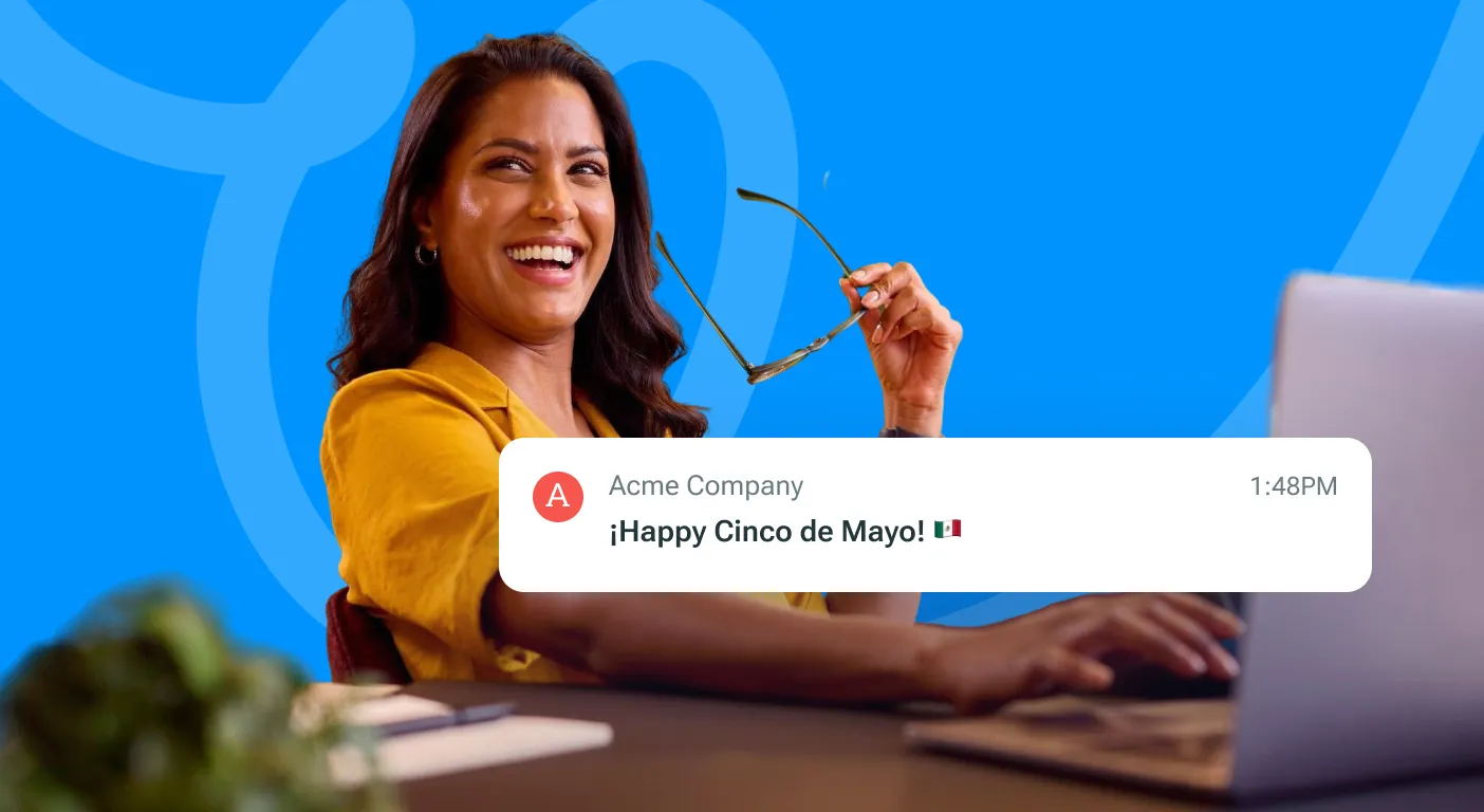 Woman laughing at a laptop beside an email notification reading Happy Cinco de Mayo.