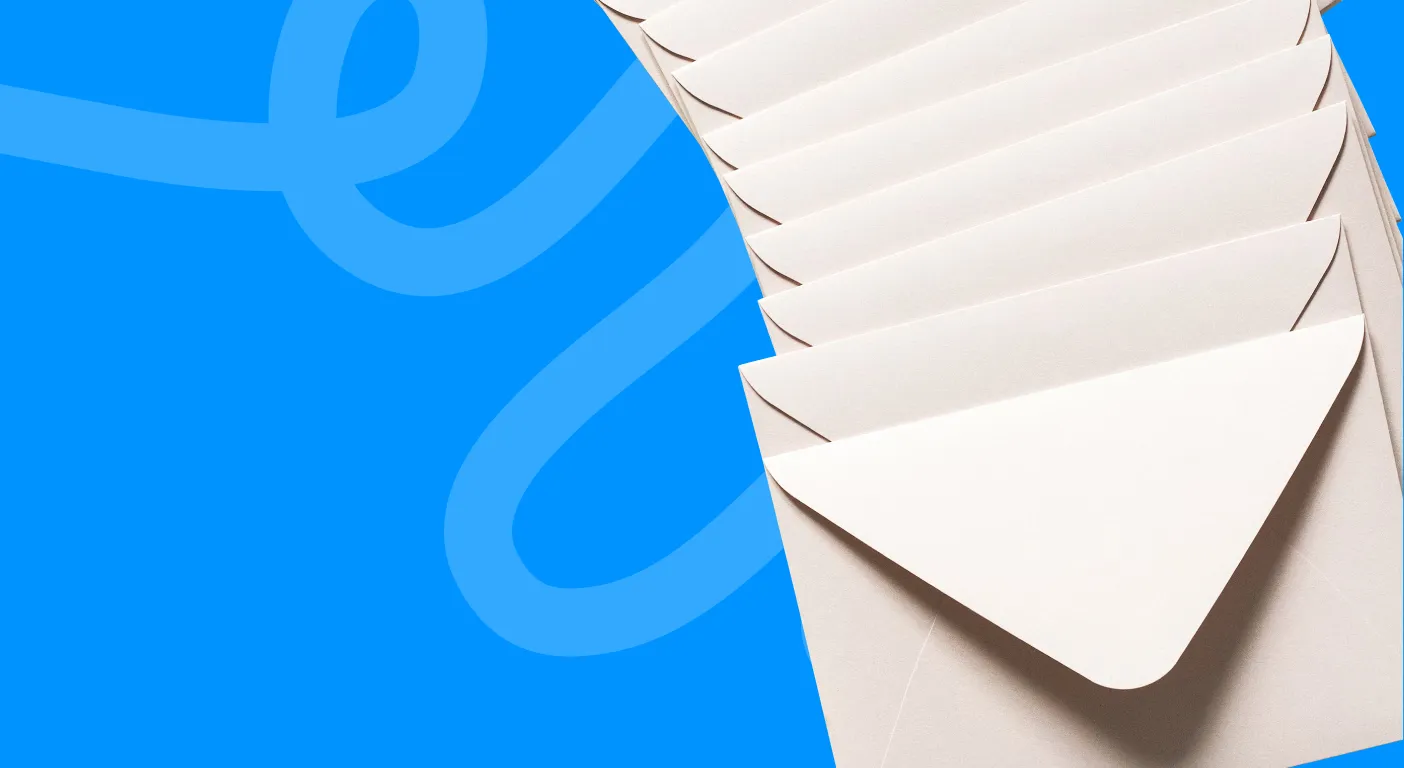 Stack of plain white envelopes fanned out on a blue background.