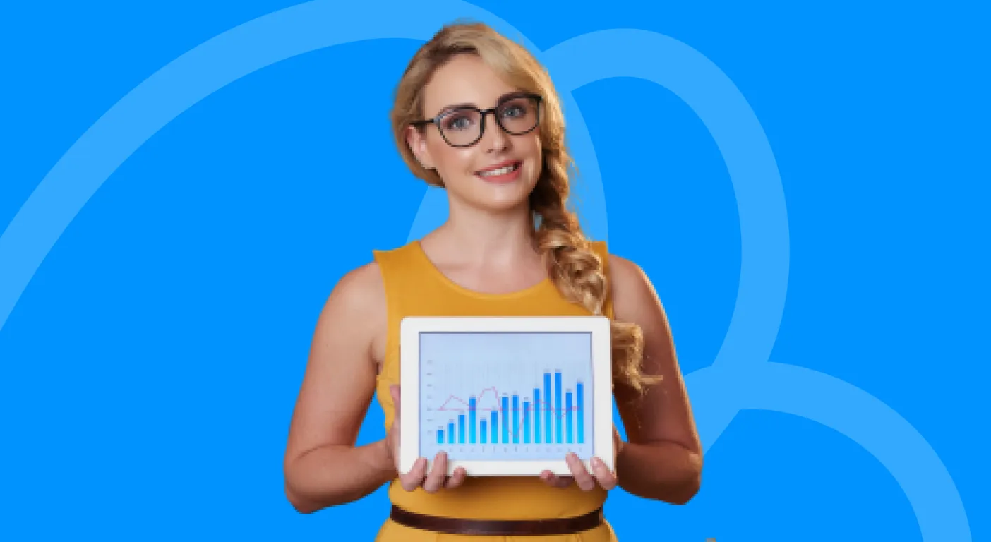 Woman in glasses holding up a tablet showing a rising bar chart.