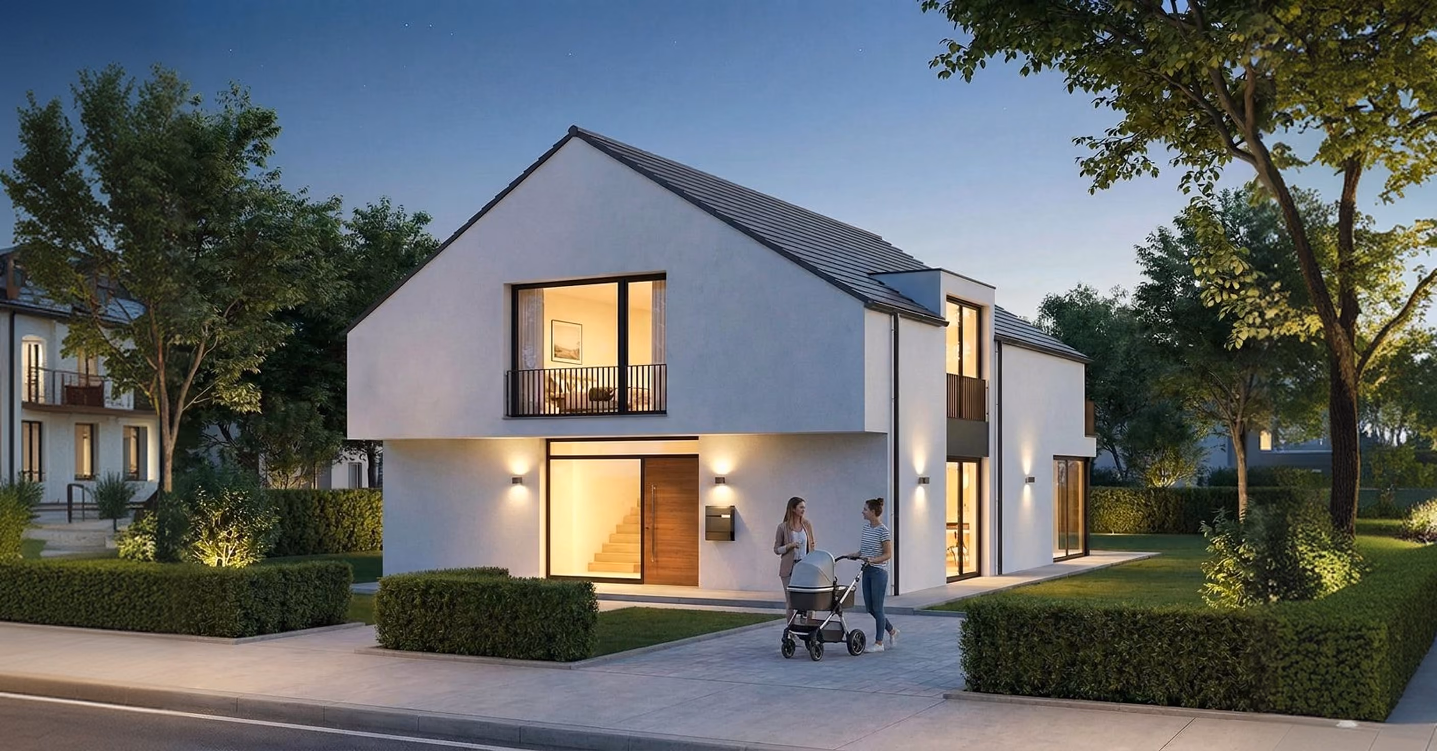 Modernes Einfamilienhaus mit Satteldach von GFK Hausbau in der Abenddämmerung