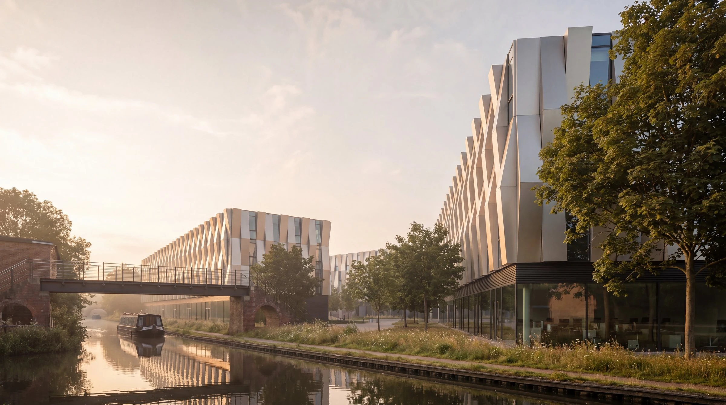Computer-generated image of the proposed mixed-use scheme at Althorpe Street, Leamington Spa, seen from the Grand Union Canal: a contemporary building with a glazed commercial ground floor and student accommodation in the silver-clad upper floors, above the canal towpath.