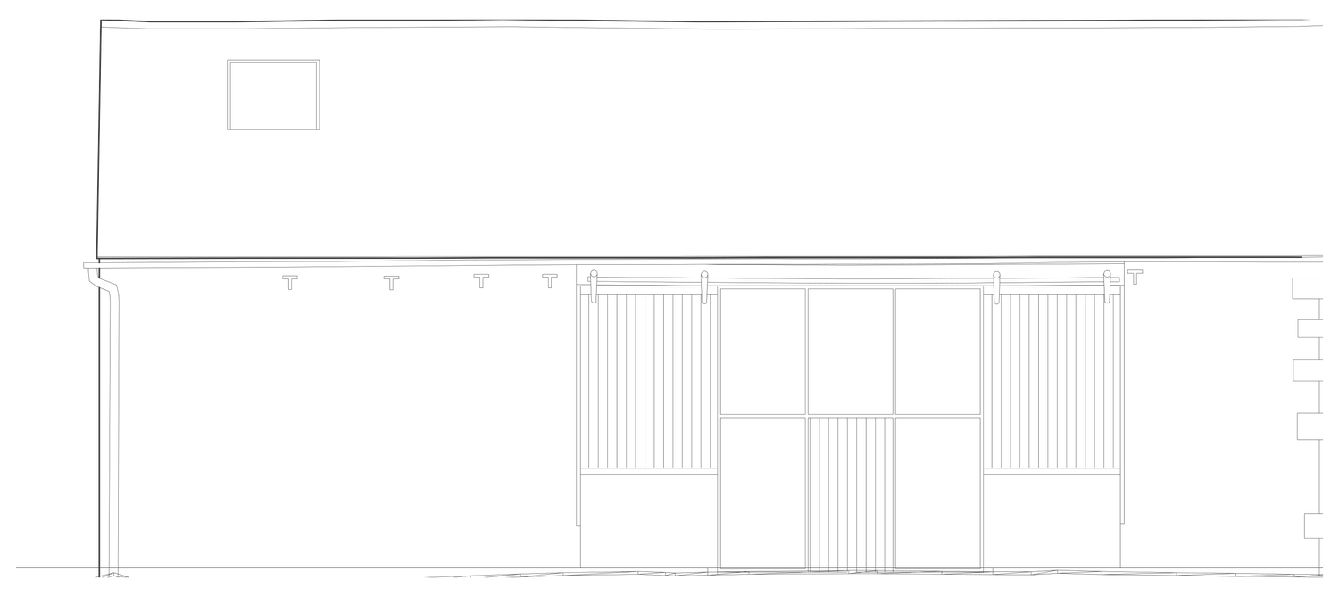 Rickett Architects drawing of the north elevation as consented: the front door set inside the existing central barn opening behind glazing and sliding screens, with the stone wall otherwise unaltered