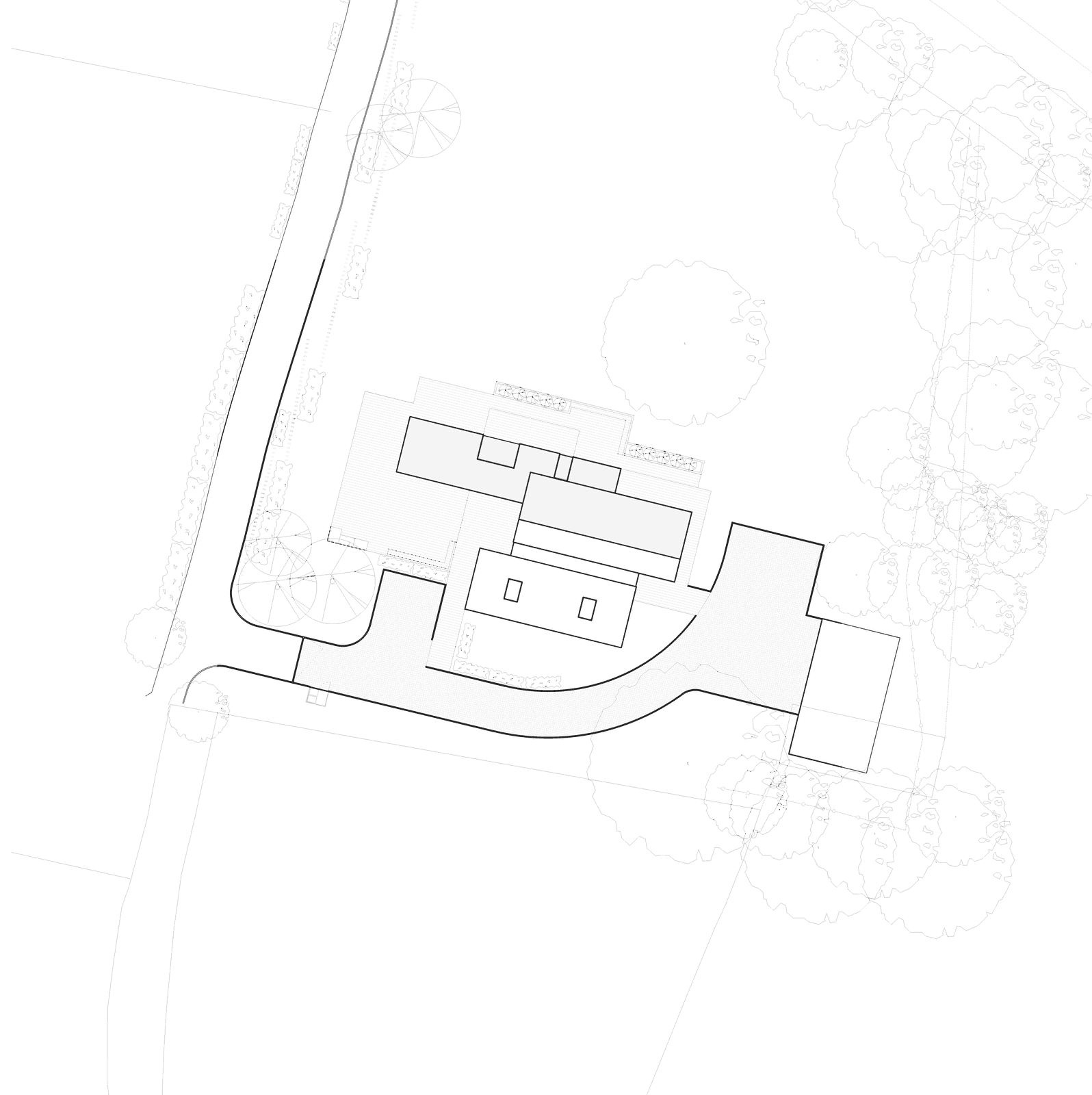 Rickett Architects site plan for Hazell House: the new house and detached garage placed low in the treed plot on the footprint of the former buildings, the existing access running in from the lane, with the retained mature trees drawn faintly around the boundary