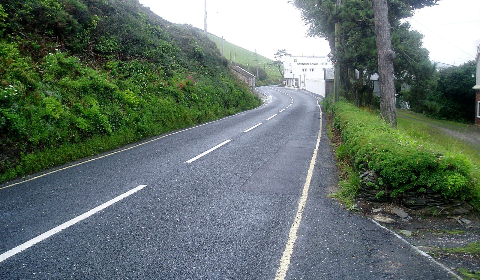 Photograph of Saunton Road in 2007, climbing past the Preston House site between steep banked verges, the existing hotel just visible in the distance
