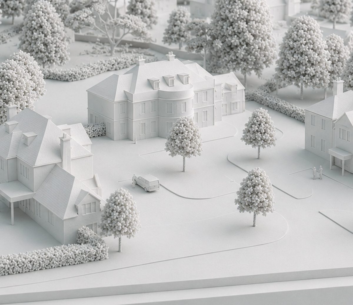The principal house of the Ide Hill development in white model form, with classical detached houses and tree-lined drives around it. A visualisation of the scheme.