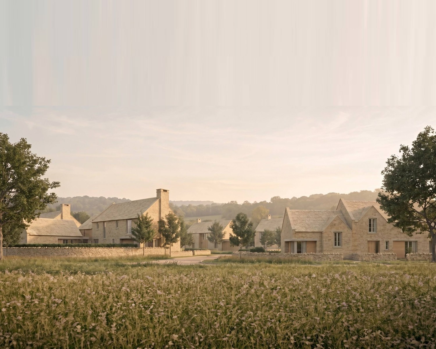 Visualisation of the consented scheme at Oakridge Lynch, near Stroud: nine Cotswold stone houses kept low against the village edge, with the retained meadow in the foreground.