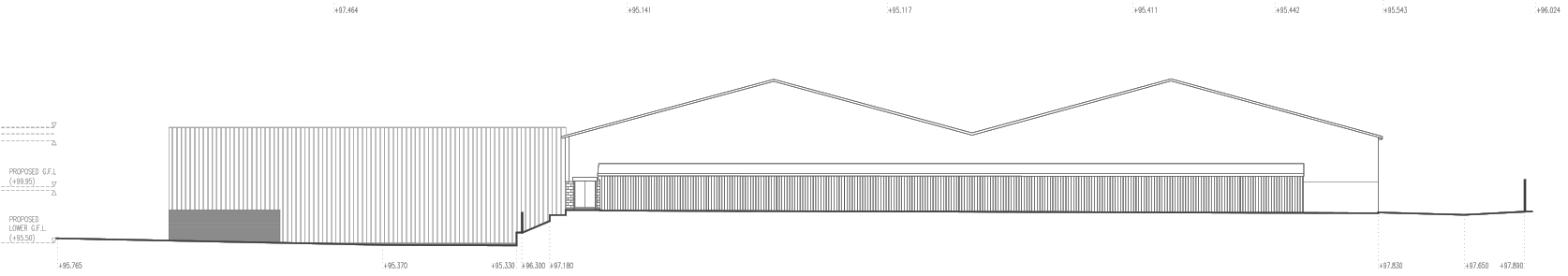Proposed rear south-west elevation drawn as a fine line drawing: at the left the new flat-roofed extension clad in close vertical profiled sheeting with a darker panel at its base, at the right the existing warehouse with two pitched spans and a long band of vertical cladding beneath, the ground line stepping down between them, with proposed floor levels dimensioned at the far left