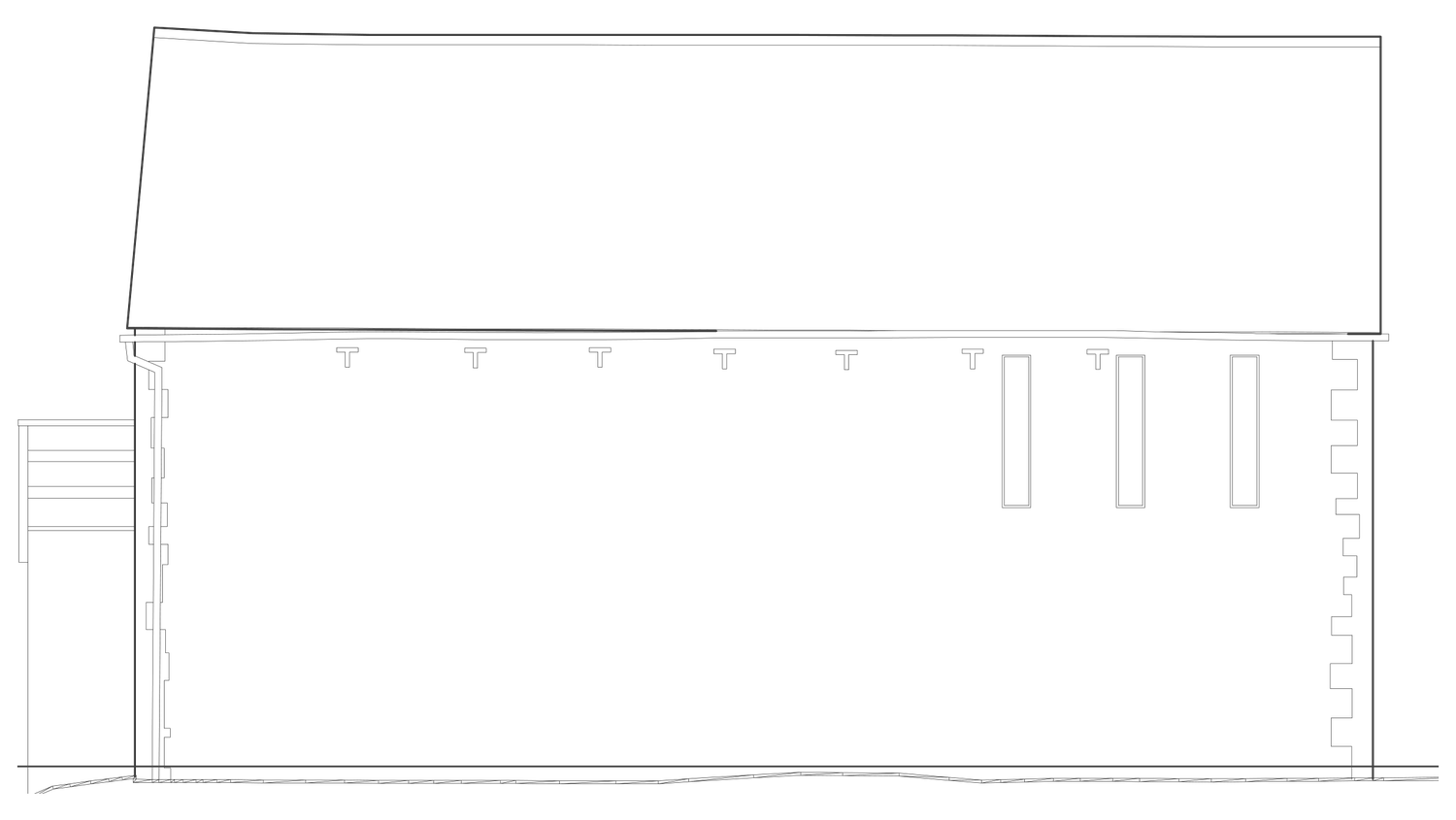 Architect's drawing of the cart house north elevation as consented: a long blind stone wall broken only by three narrow slot windows at first floor level, lighting the circulation behind