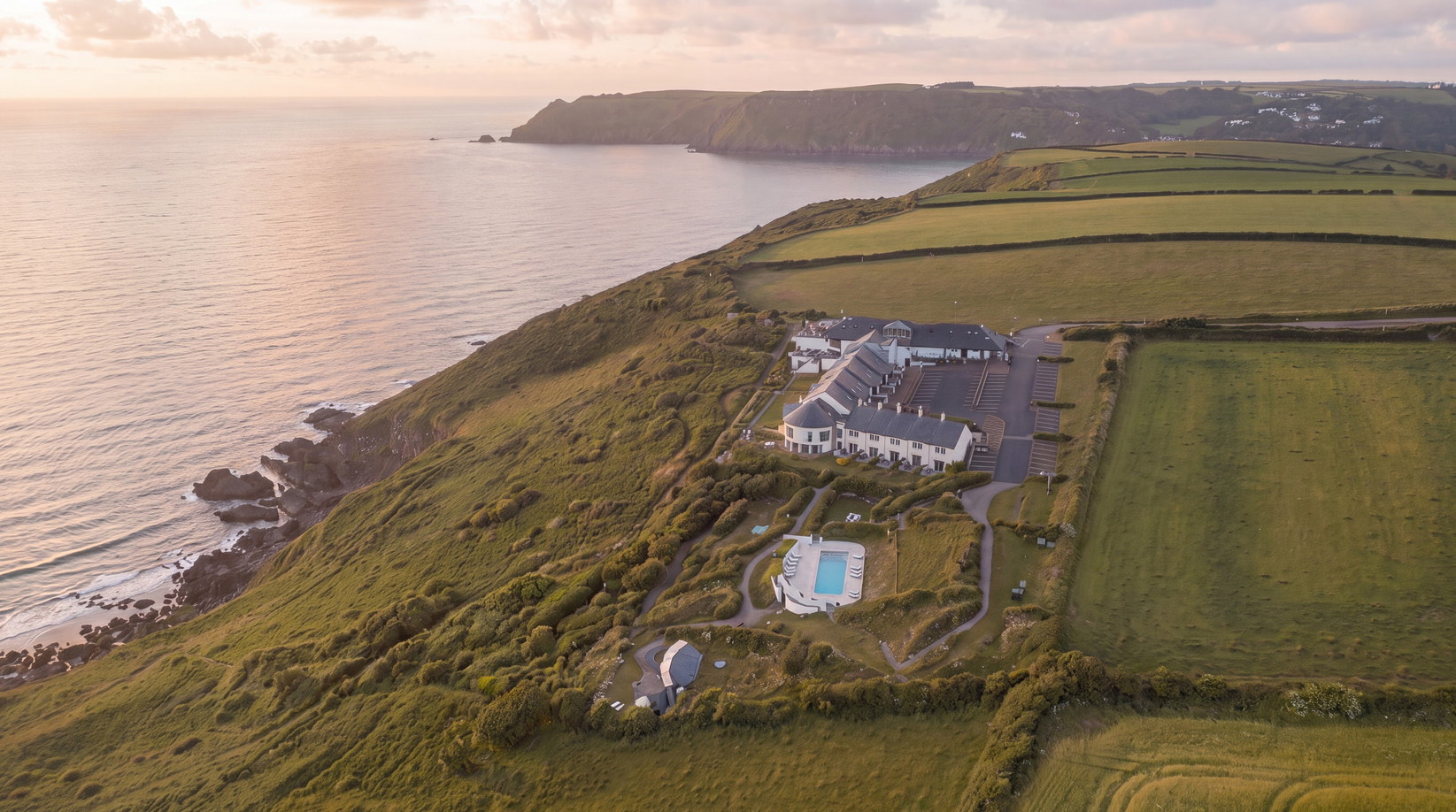 A clifftop hotel and spa above the sea at Gara Rock, Salcombe, by Rickett Architects