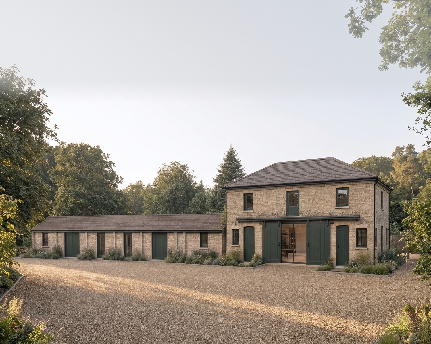 A visualisation of the consented scheme at Burghley Mansions, Peterborough: the two-storey yellow brick coach house with its green sliding carriage doors kept as shutters to a full-height glazed opening, and the converted single-storey garage range beside it.