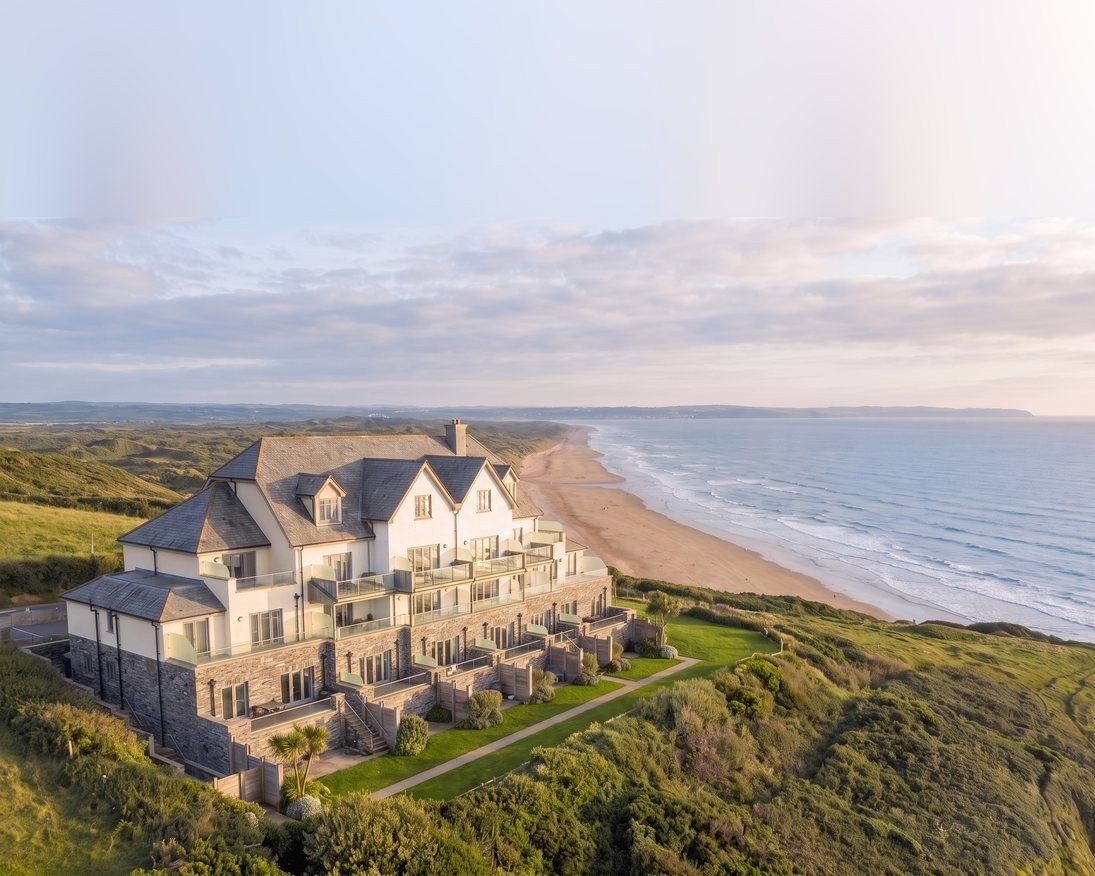 Contemporary visualisation of Ocean Point at Saunton Sands, North Devon: sixteen holiday apartments stepping down a clifftop above the beach.