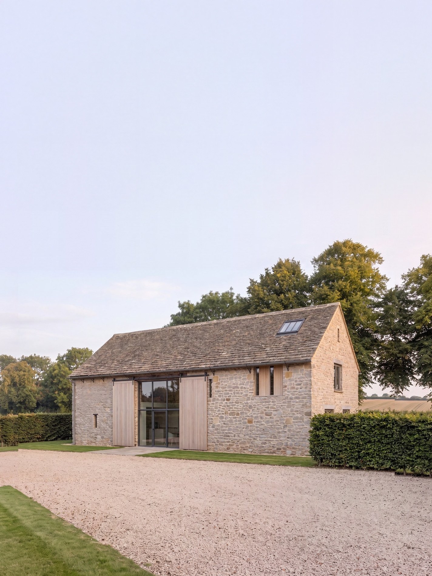 Visualisation of the consented scheme at a South Warwickshire barn: a tall single-cell limestone barn converted to a house, seen from the south east.