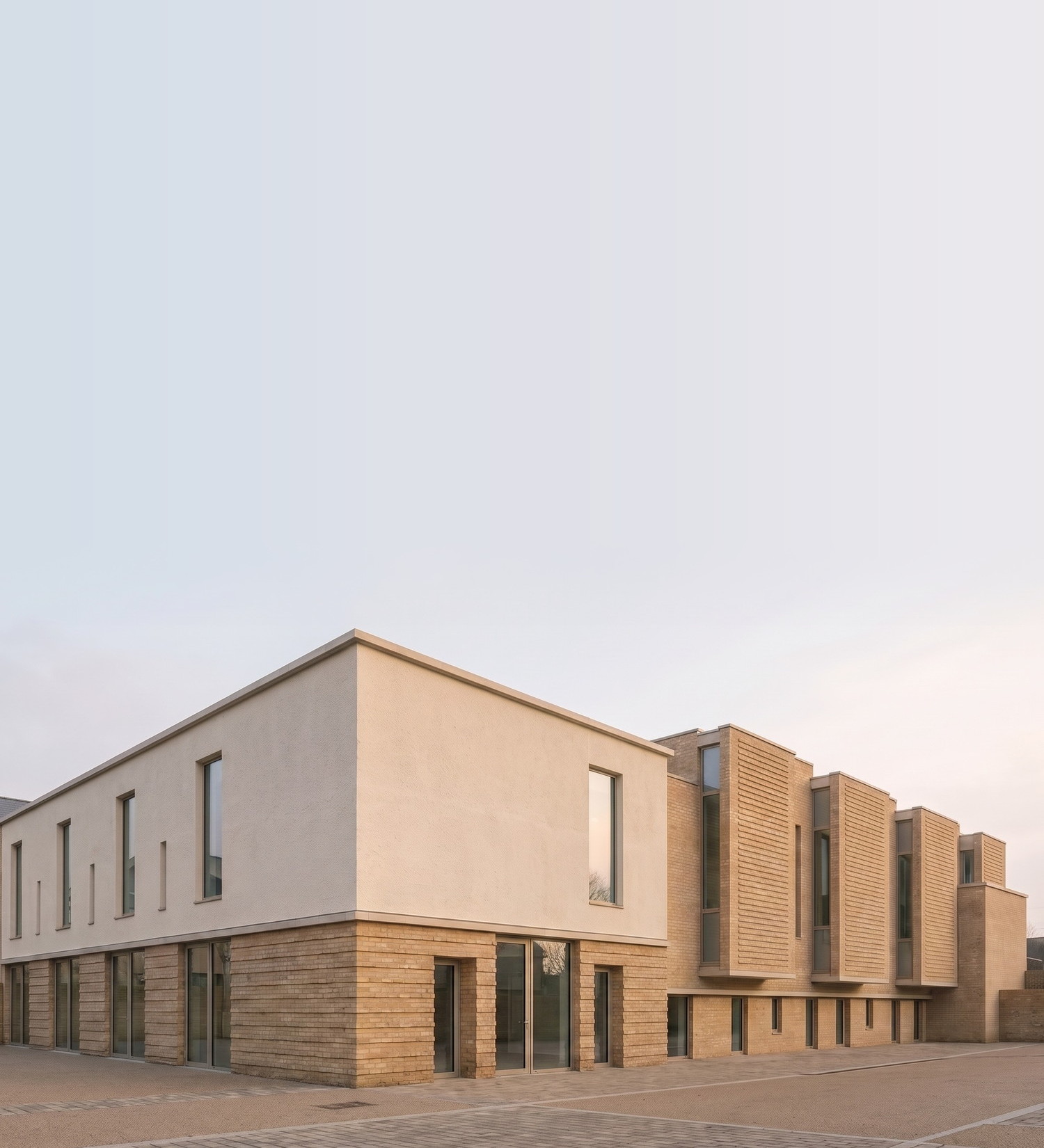 Visualisation of the proposed auditorium at the Carlton Road campus in Nottingham, by Rickett Architects: a two-storey building with tall projecting bays along its flank.
