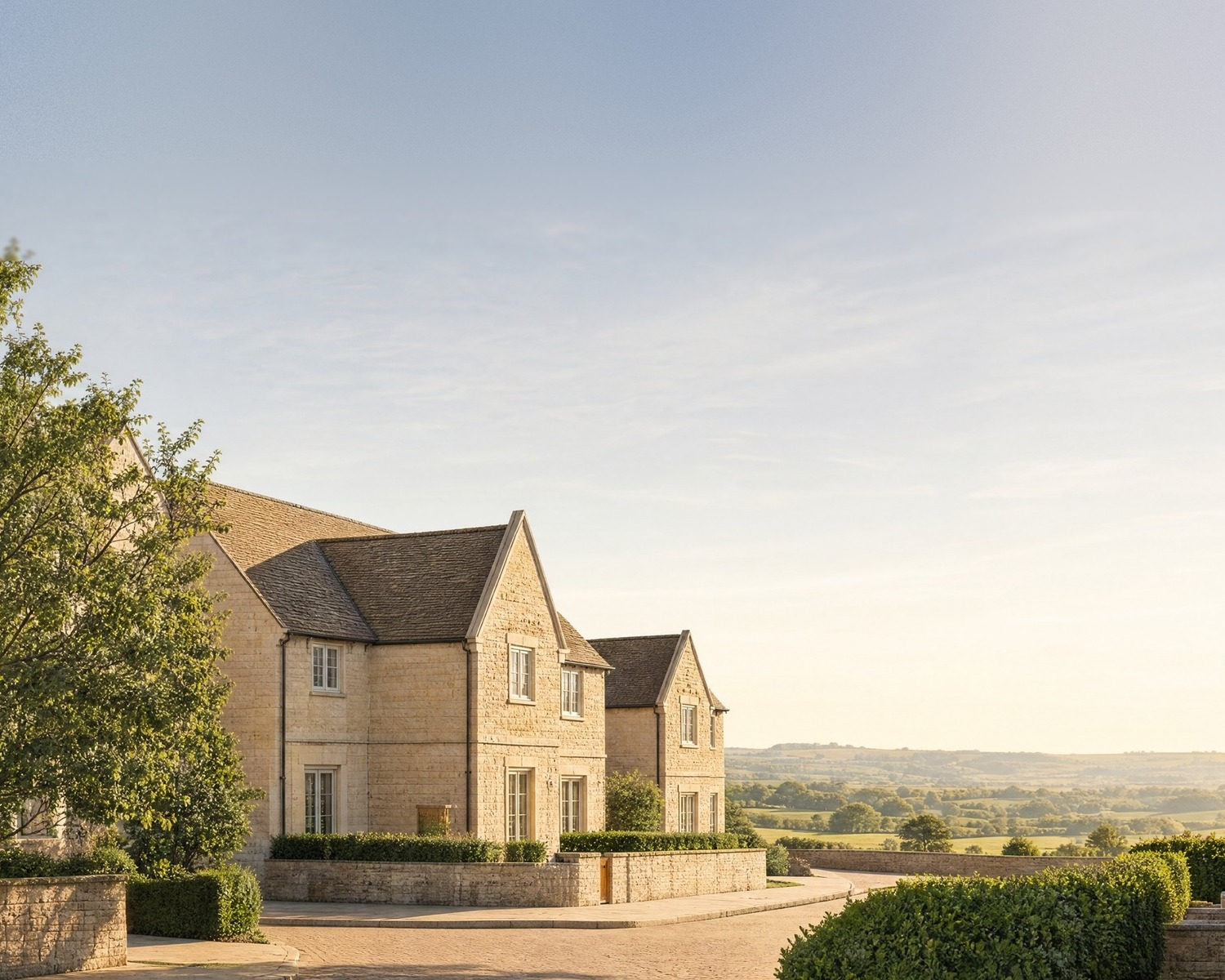 Visualisation of Jubilee Gardens, Chipping Campden: Cotswold stone homes along a lane with dry stone walls and a wide valley view beyond.