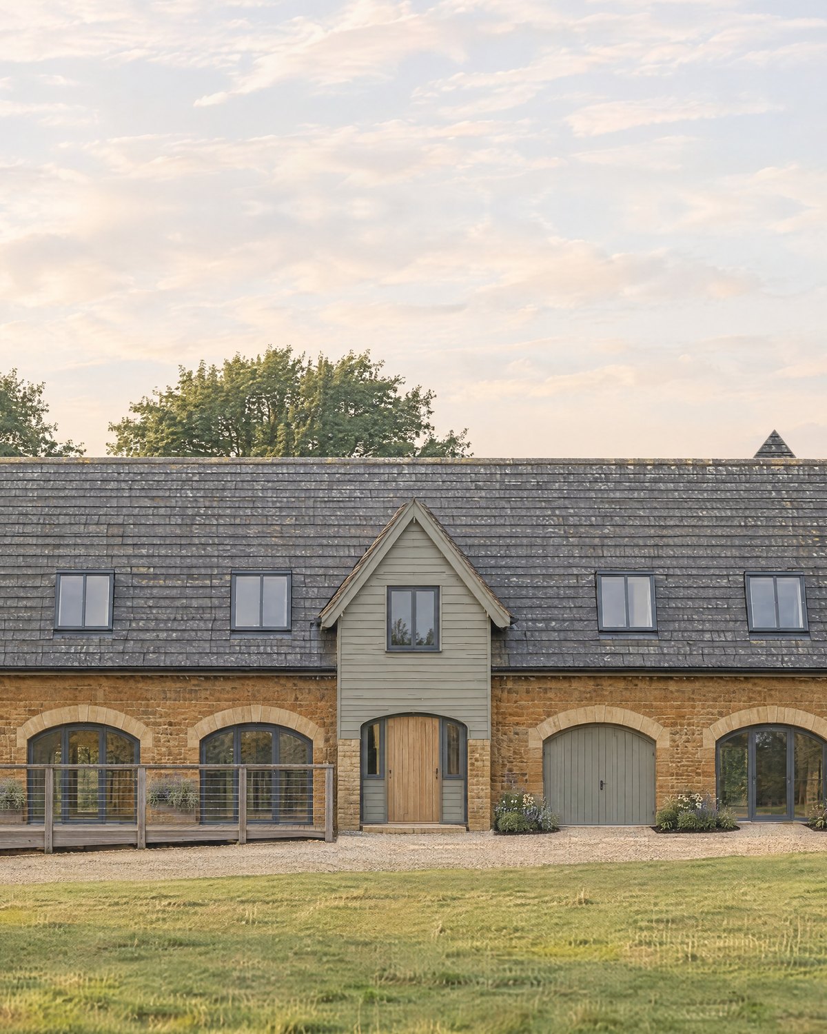 Visualisation of the approved conversion of the stone wedding venue, with arched openings and a timber gable