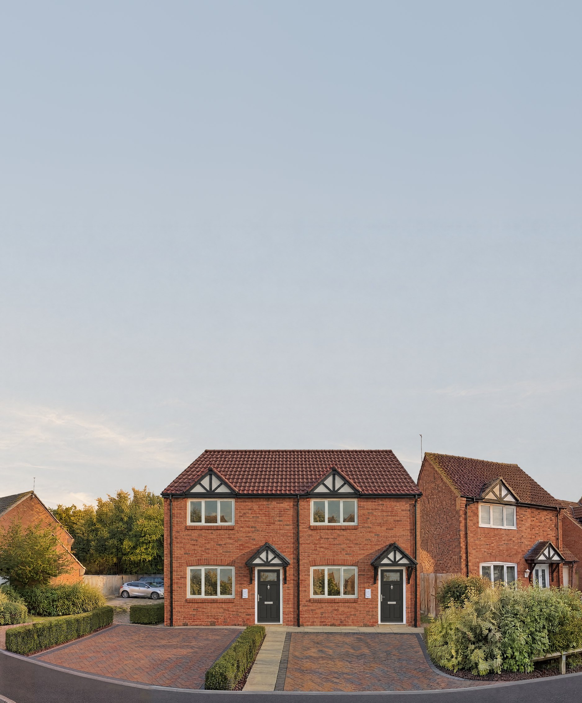 Visualisation of two semi-detached homes in the gap between houses on Montgomery Road, Whitnash