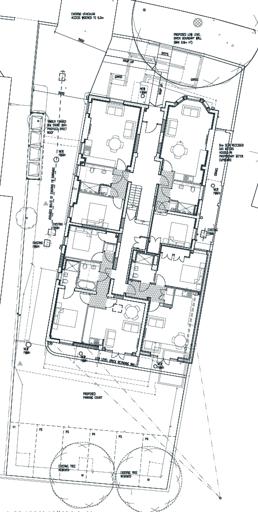 Approved site plan: four ground-floor flats, a front garden, a widened drive and six parking spaces behind