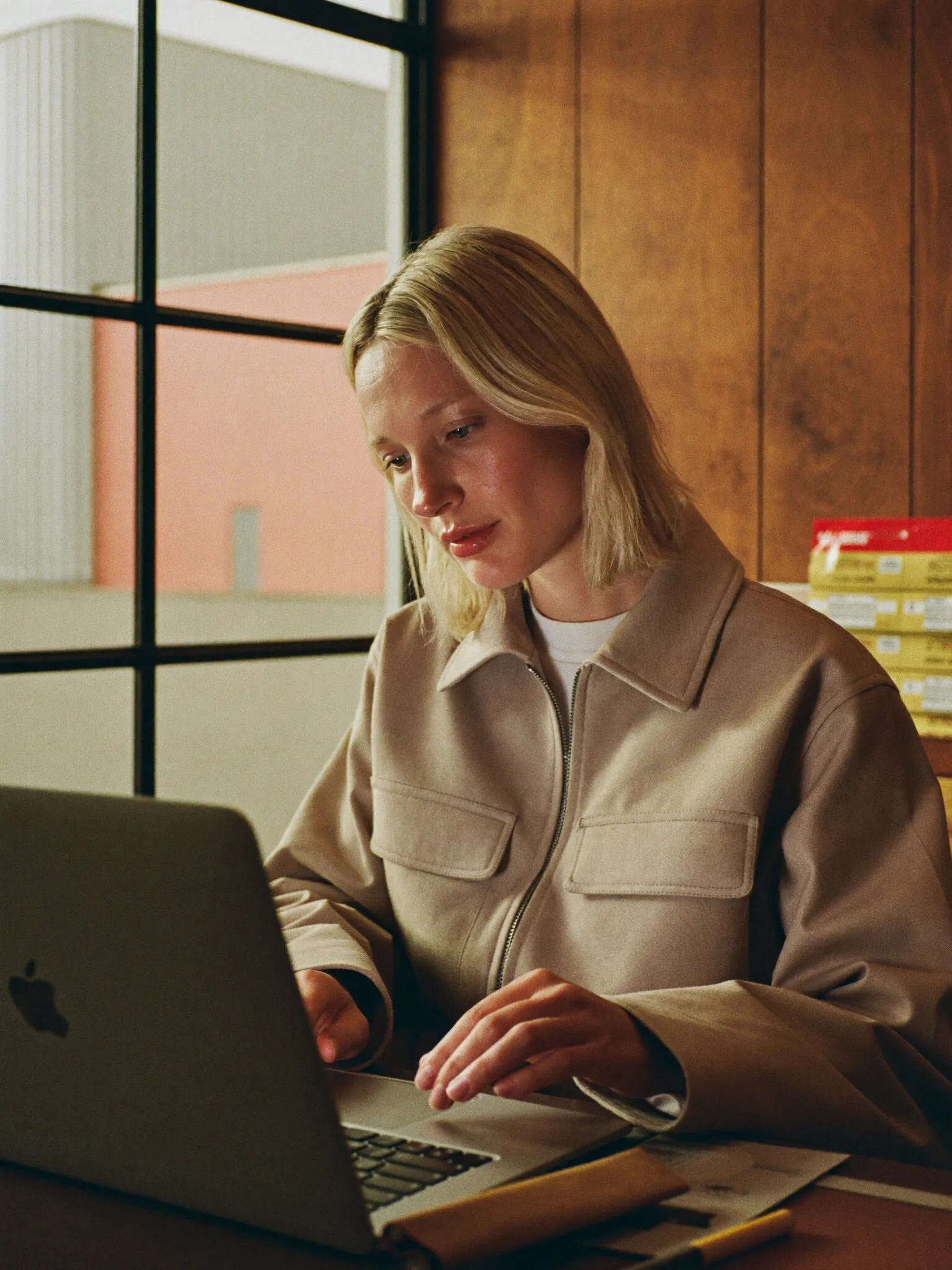Logistics coordinator working at a laptop