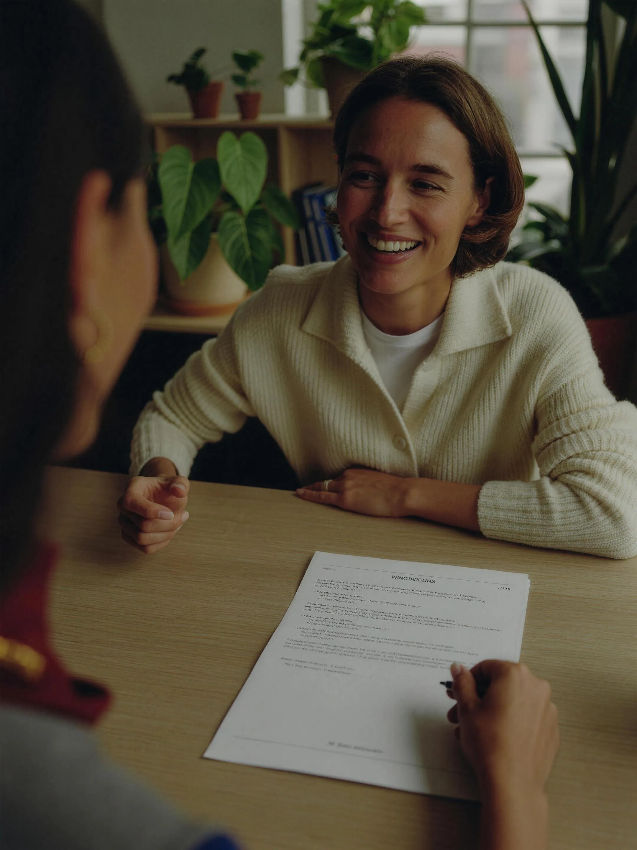 Recruiter smiling across the table during an interview