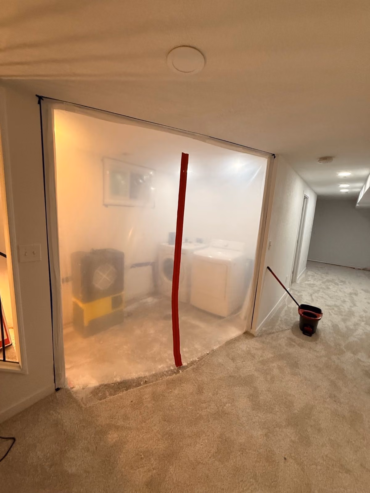 Containment zip-wall on a water loss
