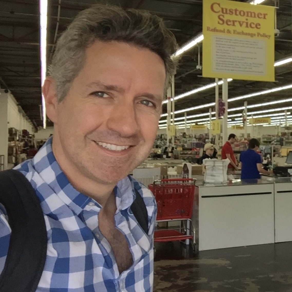 Drew Sanocki smiling in a store