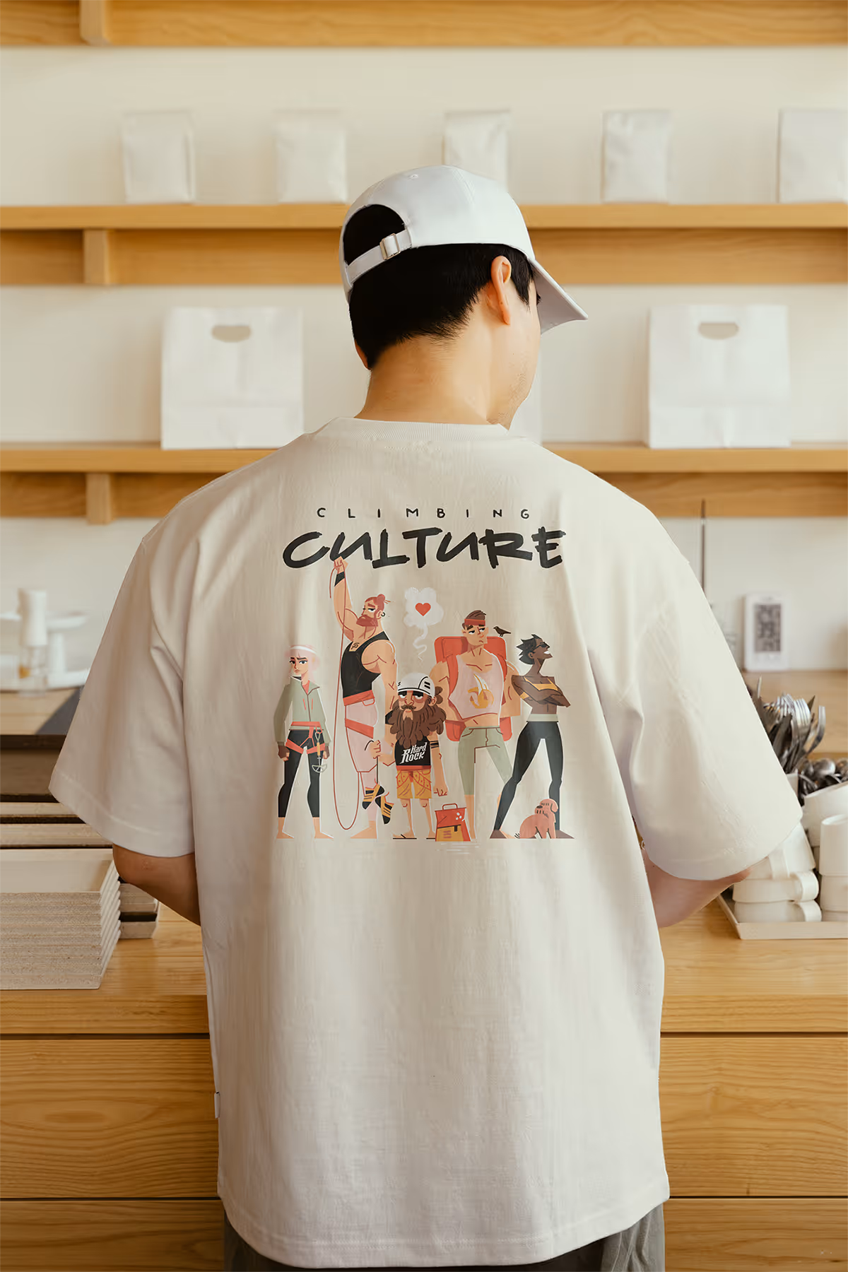 Climbing in Berdorf T-shirt seen from behind: a group of illustrated climbers under the words “Climbing Culture”
