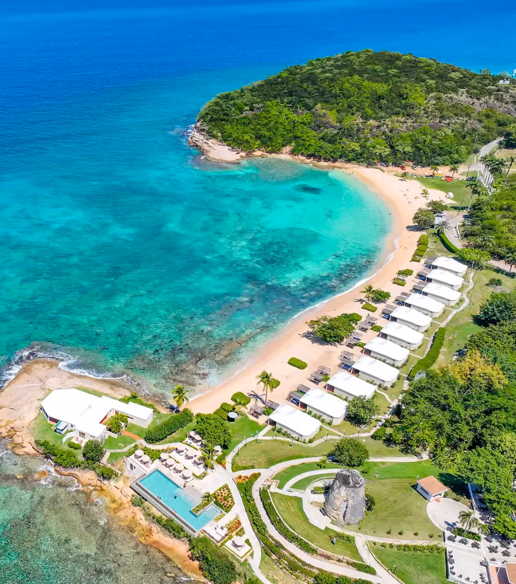 Aerial view of Hawksbill Resort's grounds, pool and coastline, Antigua