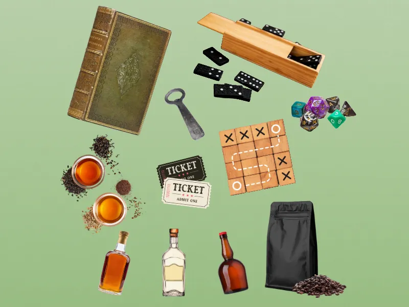 Square-cropped flat-lay of anniversary gift objects: an antique book, a domino set, a bottle opener, polyhedral dice, a tic-tac-toe board, two tickets, tea, liquor bottles, and coffee beans.