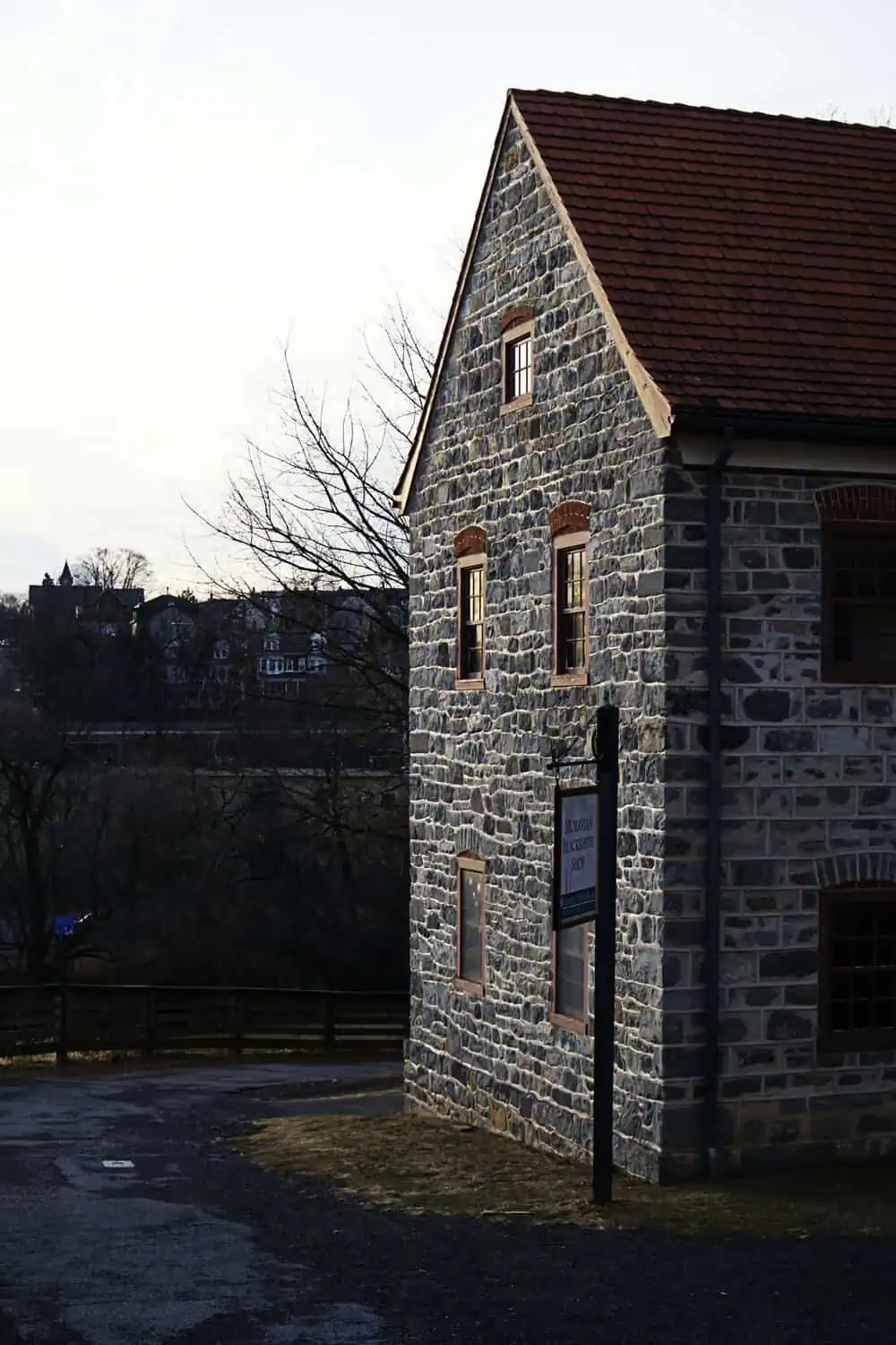 A cobblestone street lined with historic brick buildings.