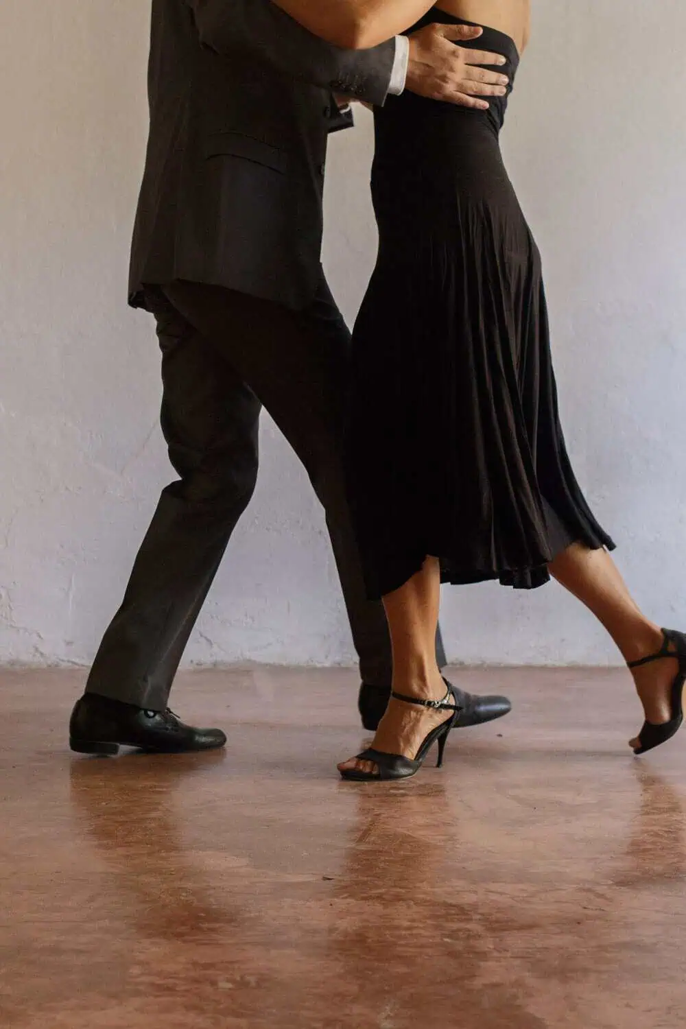 A pair of dance shoes on a ballroom dance floor.