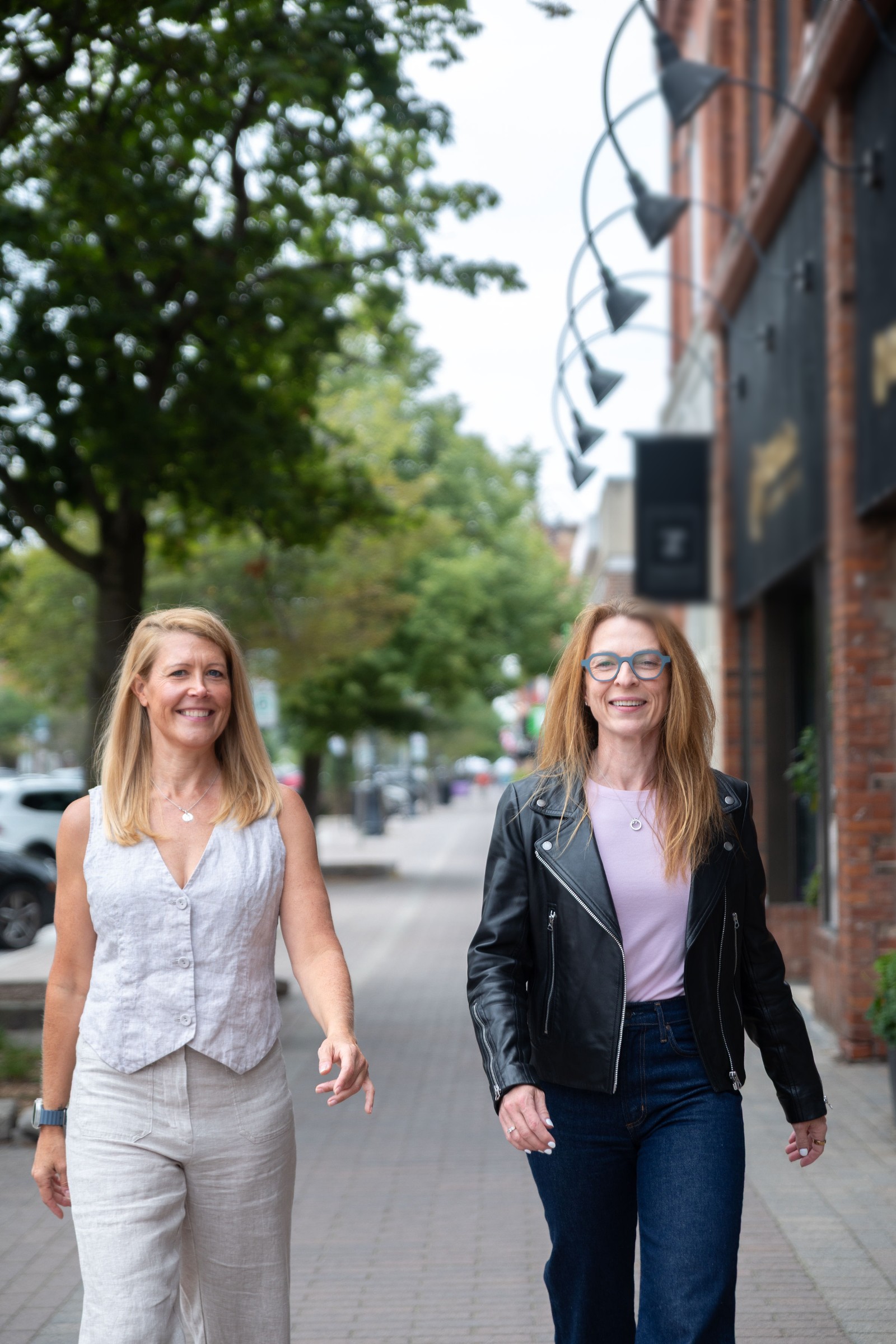 The two founders of Metoris walking down a Main Street sidewalk