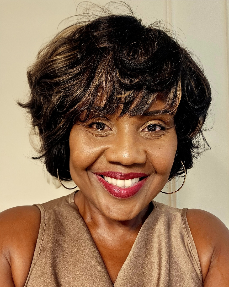 Close-up portrait of Celeste Peters smiling.