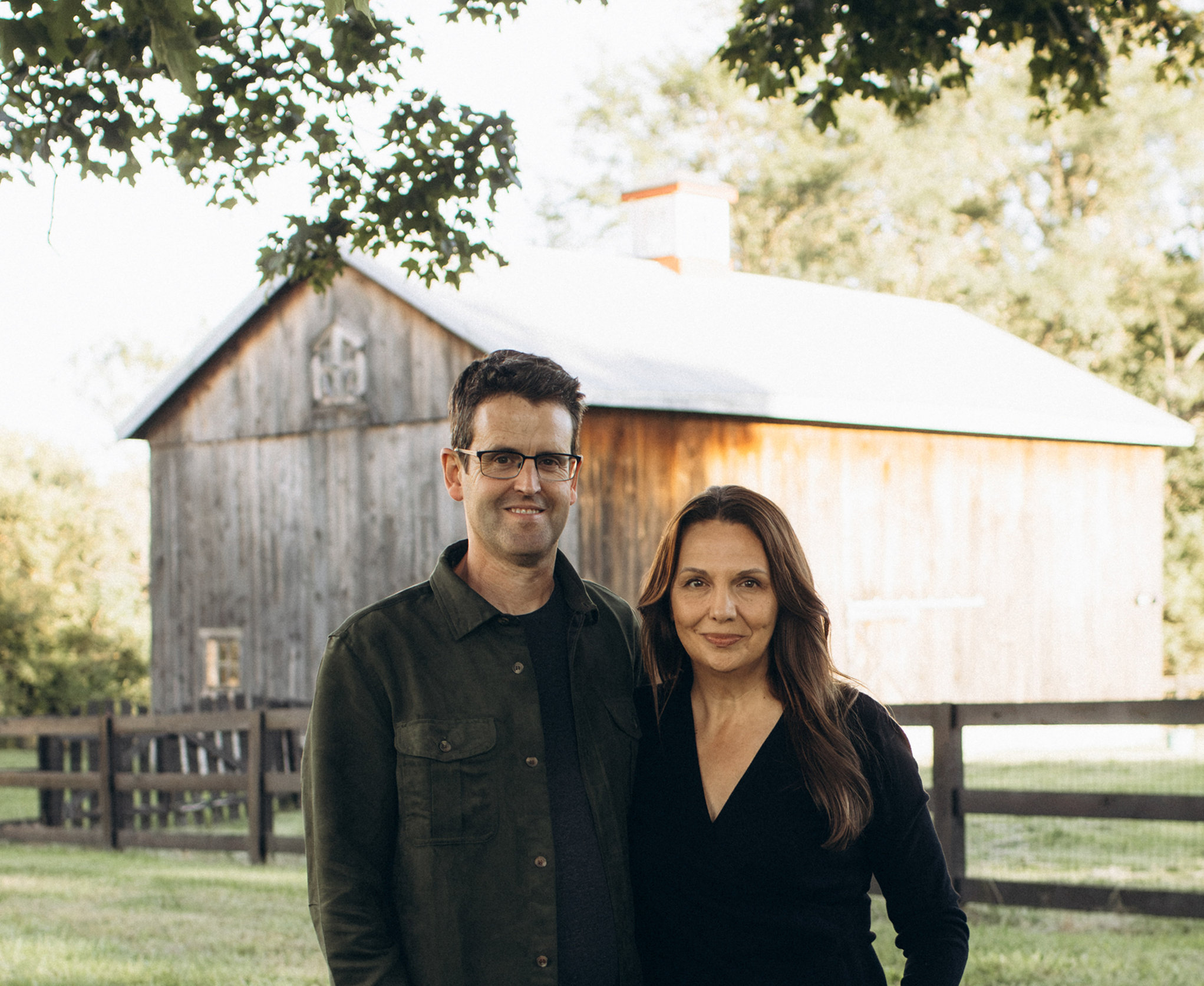 Accelevation co-founders Michael and Shawn Rubiera standing together in front of a barn