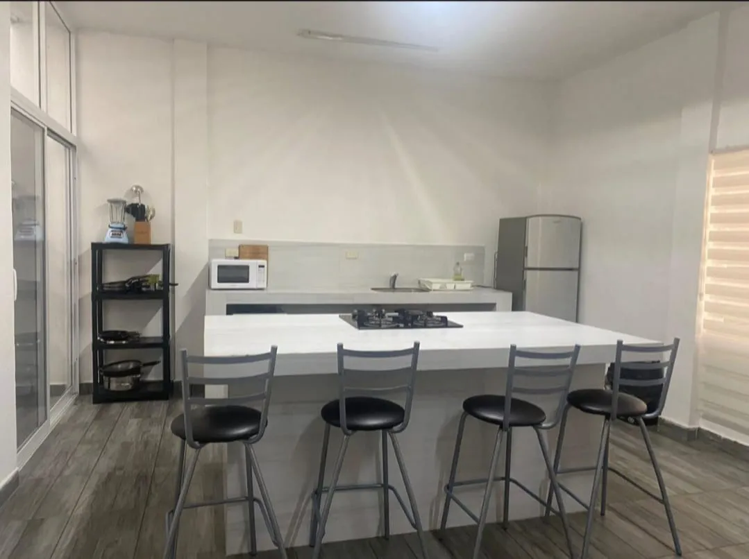 Cocina del departamento del Hotel Los Arcos Inn