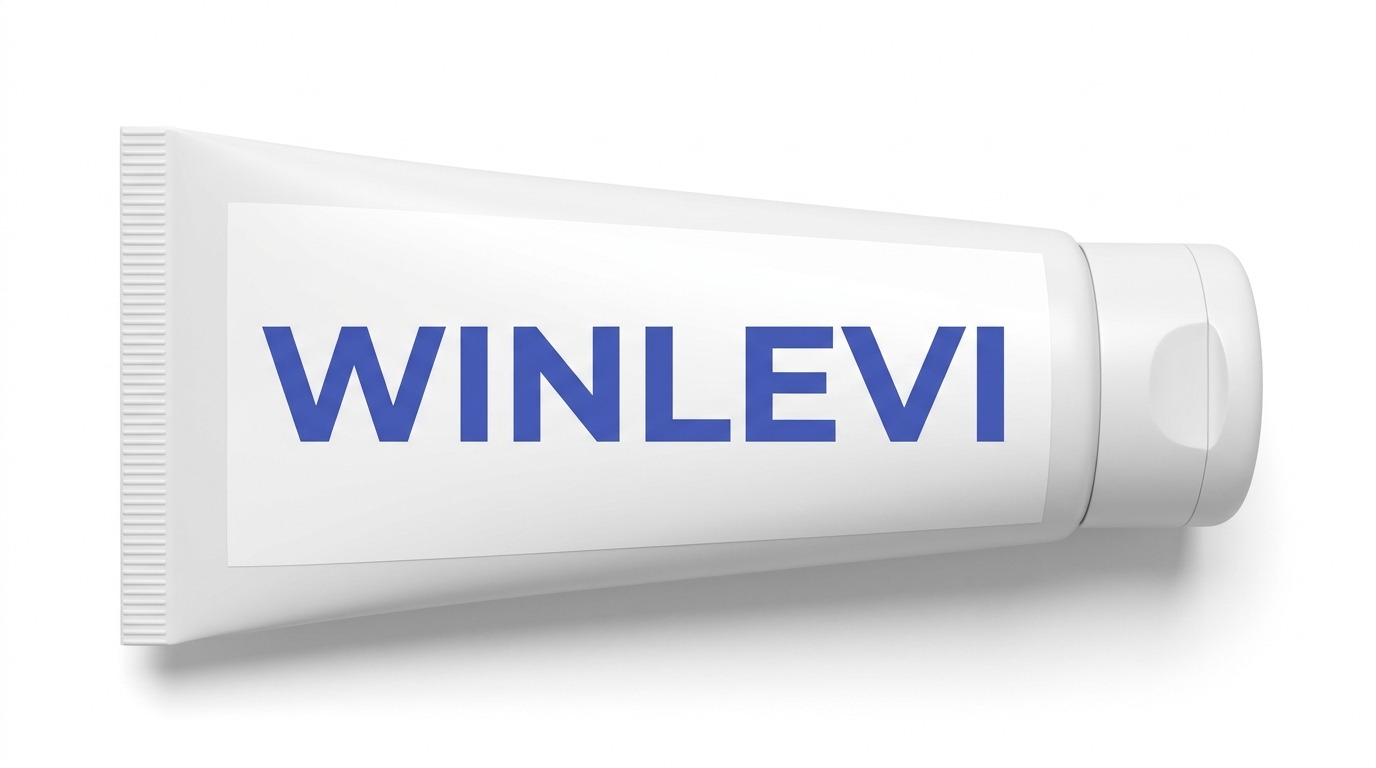 A white squeeze tube labelled Winlevi, lying on its side with the cap to the right.