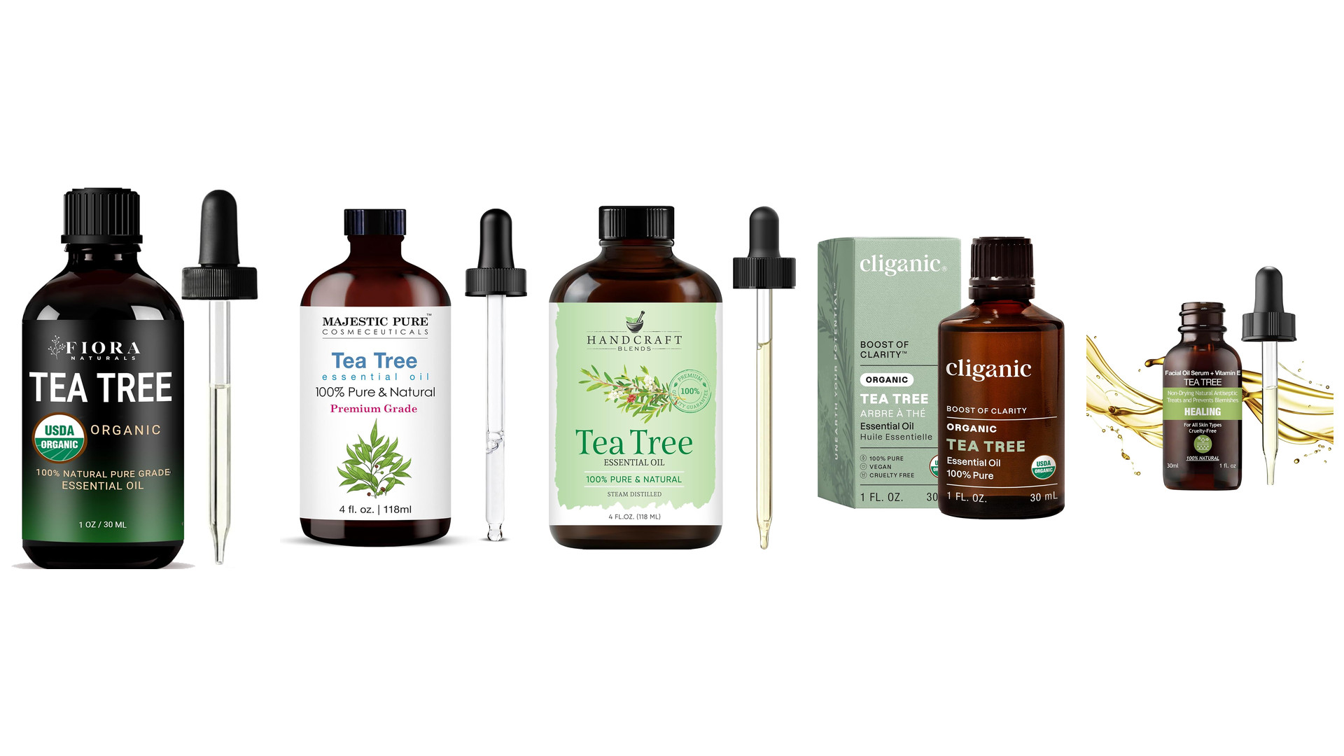 Five dark glass tea tree essential oil bottles with glass droppers and one green box on white
