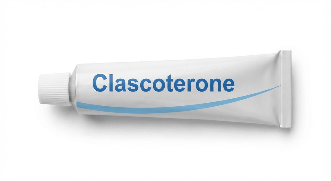 A white tube labeled Clascoterone in blue with a blue swoosh, lying on a plain white background