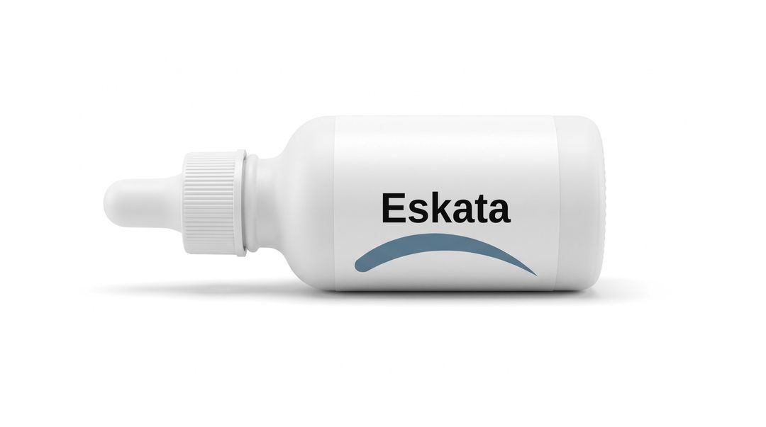 A white small dropper bottle on a white background, with a plain white label reading Eskata and a blue swoosh beneath it.
