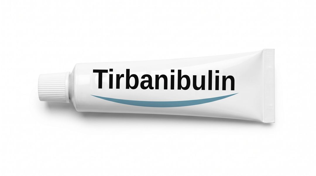A white cream tube lying on its side on a white background, with a plain white label reading Tirbanibulin and a blue swoosh beneath it.