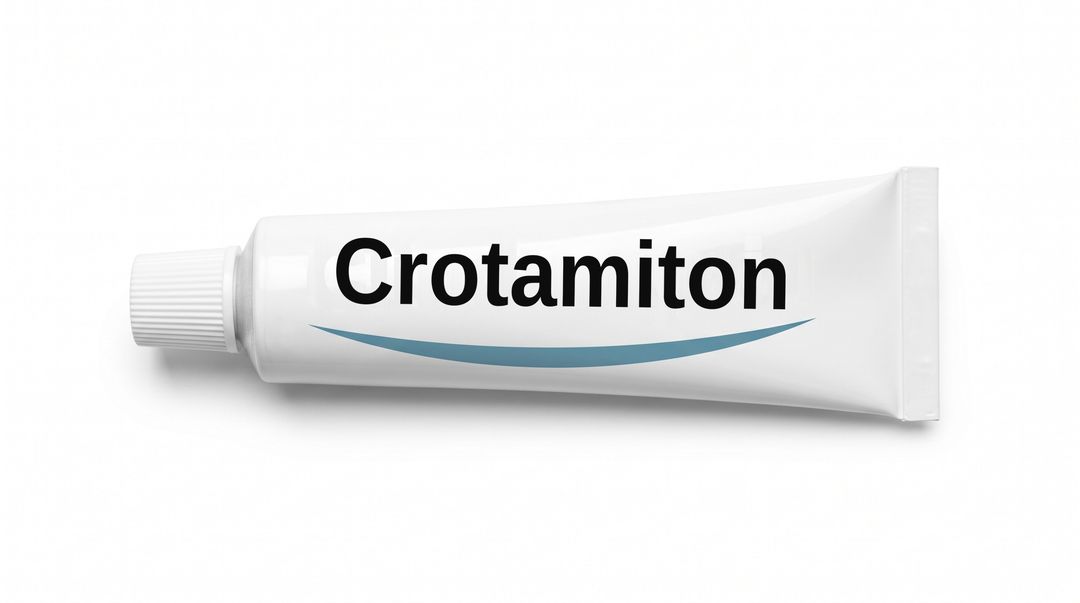 A white cream tube lying on its side on a white background, with a plain white label reading Crotamiton and a blue swoosh beneath it.