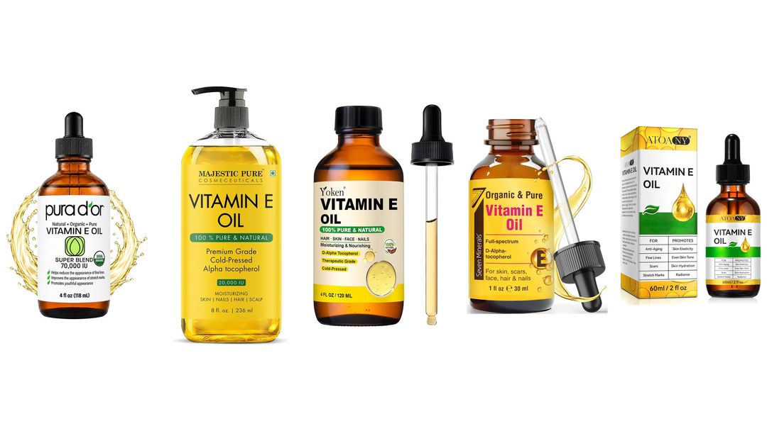 Vitamin E (Tocopherol) Four vitamin E oil bottles lined up on white, two amber dropper bottles and two clear yellow oils