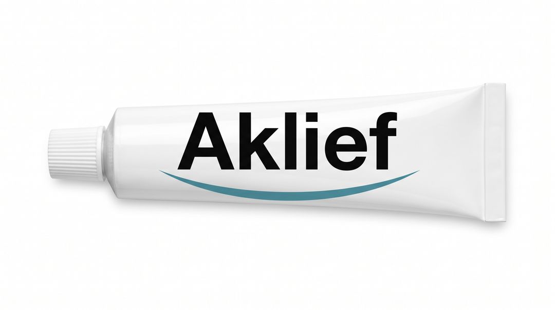 The tube A white plastic tube lying on its side on a white background, cap to the left, labeled Trifarotene in teal lettering with a pale green swoosh curving beneath the word.