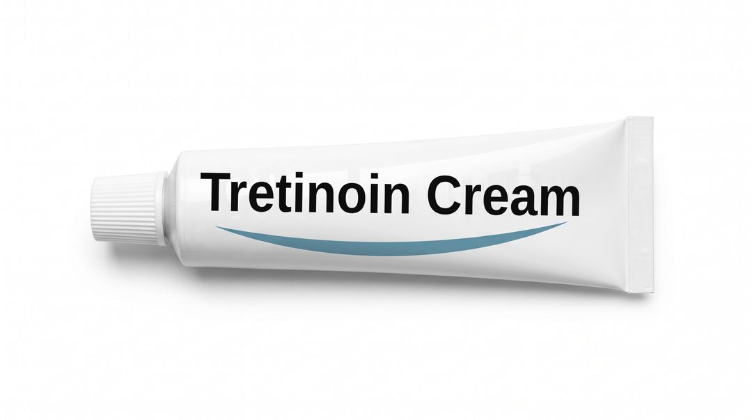 A white cream tube lying on its side on a white background, with a plain white label reading Tretinoin Cream and a blue swoosh beneath it.