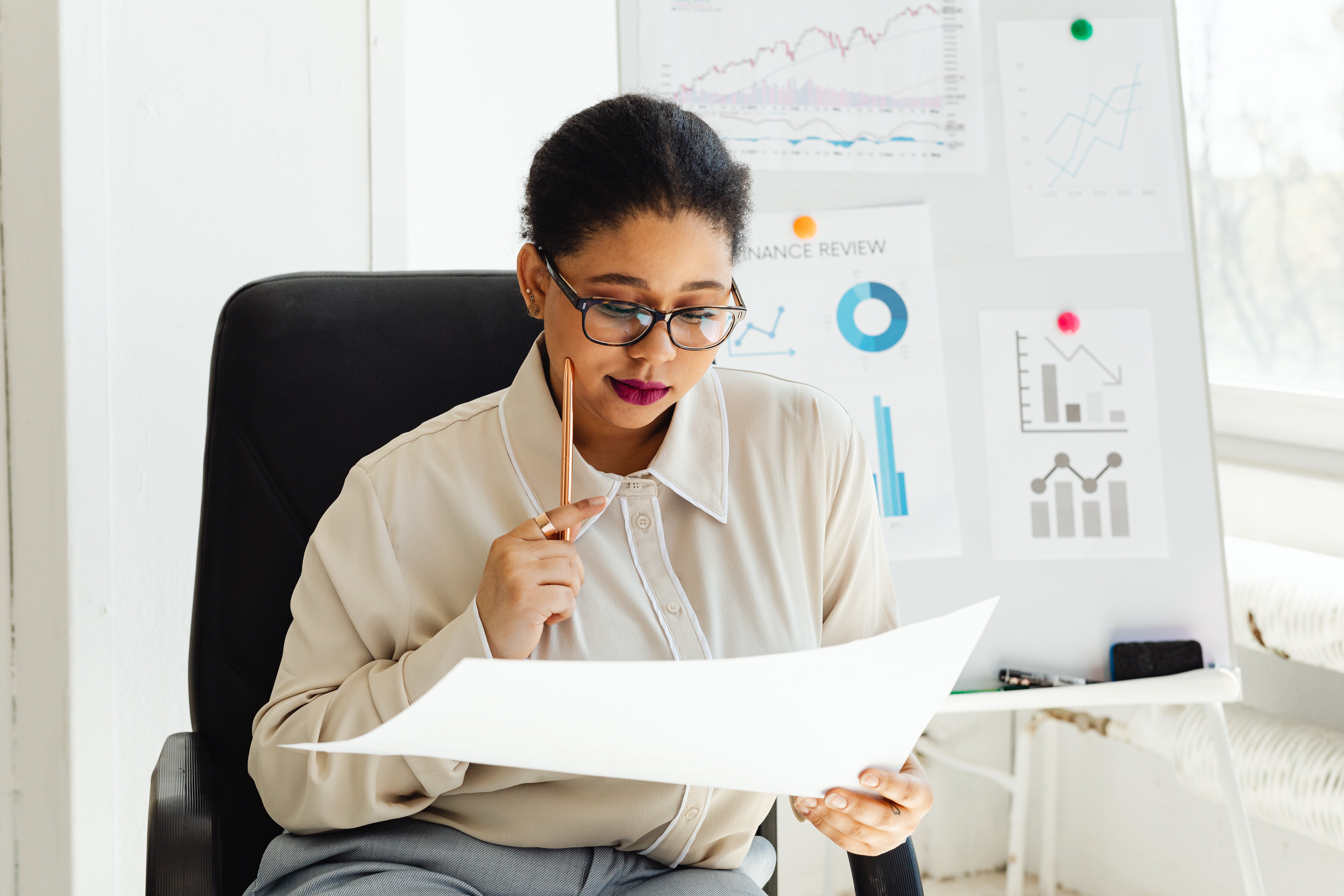 A Woman Holding a White Paper