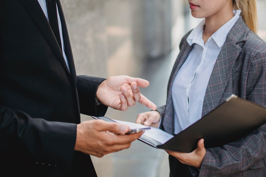 Man and woman discussing contract