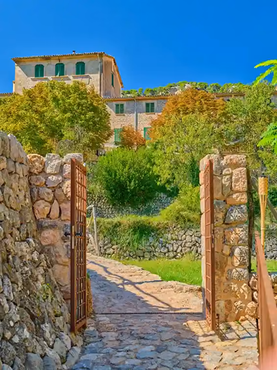 Luxury holiday rental property with Mediterranean sea view and vibrant bougainvillea in Mallorca