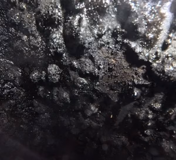internal camera view of a chimney with hardened build up inside from a chimney fire