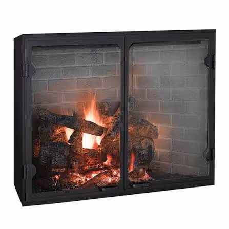 Black metal fireplace with double glass doors showing burning logs inside.