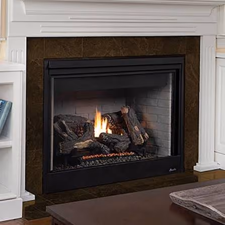 Modern indoor fireplace with glowing flames and logs set in a white-paneled living room wall.