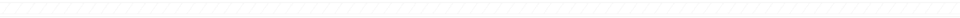Decorative black horizontal border with sharp white geometric zigzag pattern.